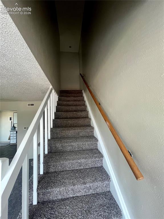 Image 14 of 27: leading to upstairs bedrooms and full bath