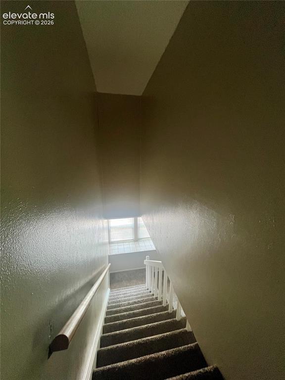 Image 21 of 27: looking down from upstairs to main level