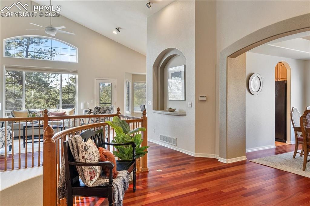 Image 6 of 46: Living area featuring wood finished floors, healthy amount of natural light