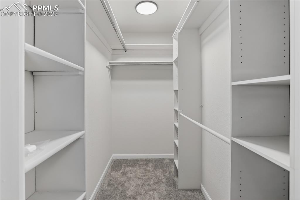 Image 14 of 24: Primary walk-in closet