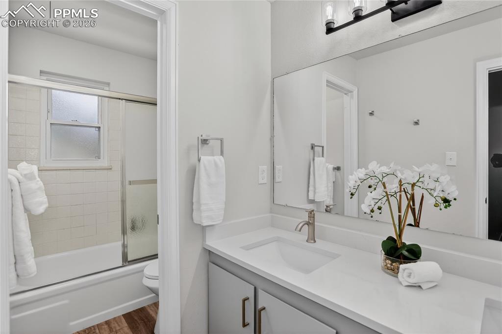 Image 15 of 24: Fully updated primary bath w/ dual sink vanity