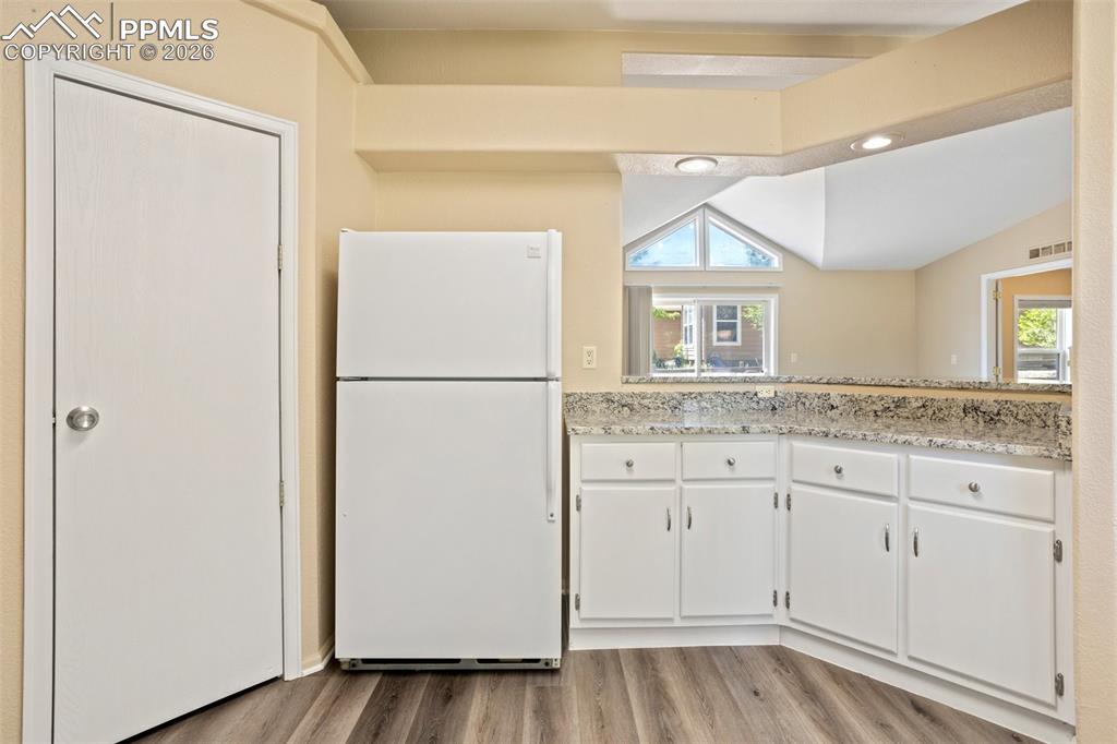 Image 14 of 37: The Kitchen showcases gorgeous granite countertops, luxury vinyl plank floo