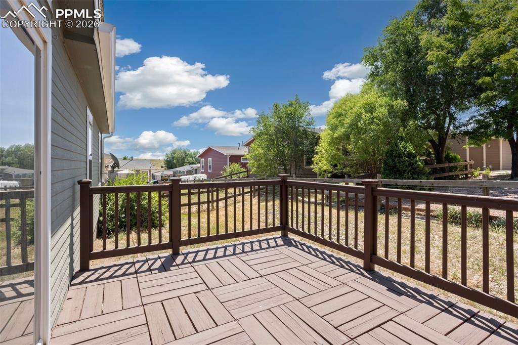 Image 30 of 37: The backyard deck allows the opportunity to enjoy the great outdoors from t