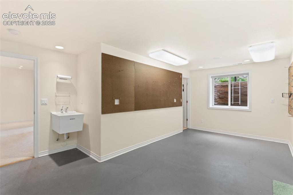 Image 30 of 40: Basement Bonus Room/Workshop/Craft Room