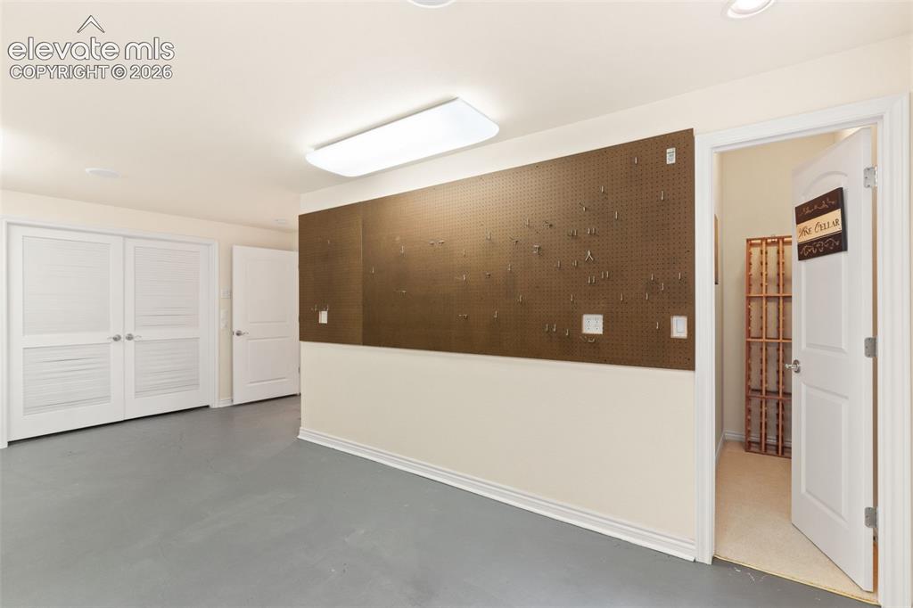 Image 31 of 40: Basement Bonus Room/Workshop/Craft Room