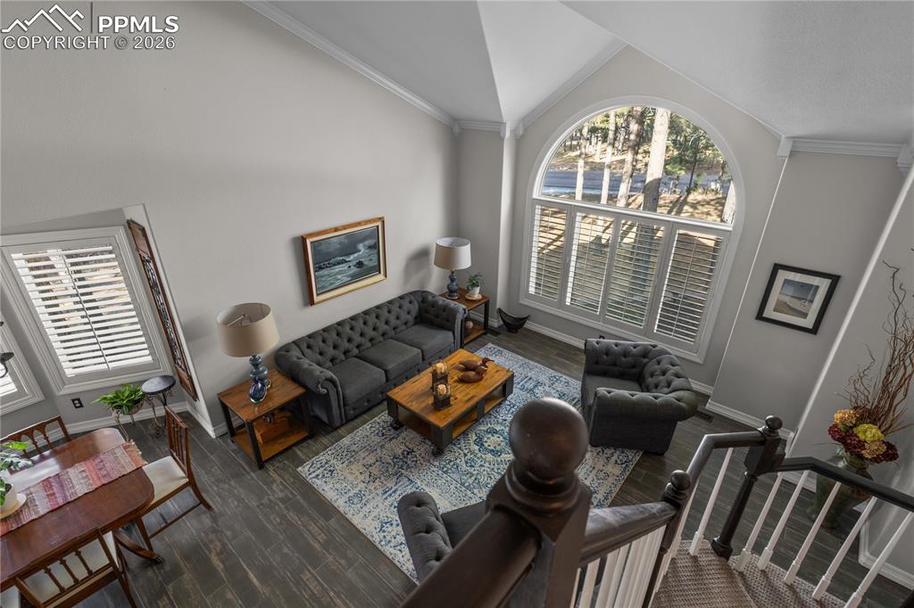 Image 10 of 38: The formal living room is adjacent to the entry of the home.  Wood like til