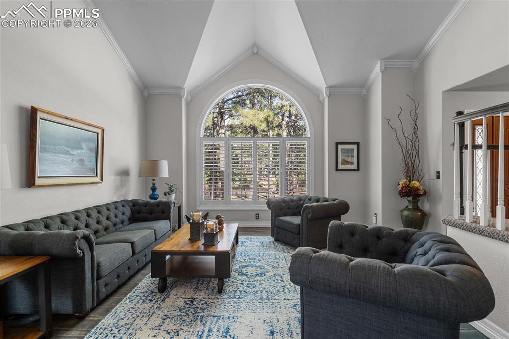 Image 11 of 38: Formal living room is bright.