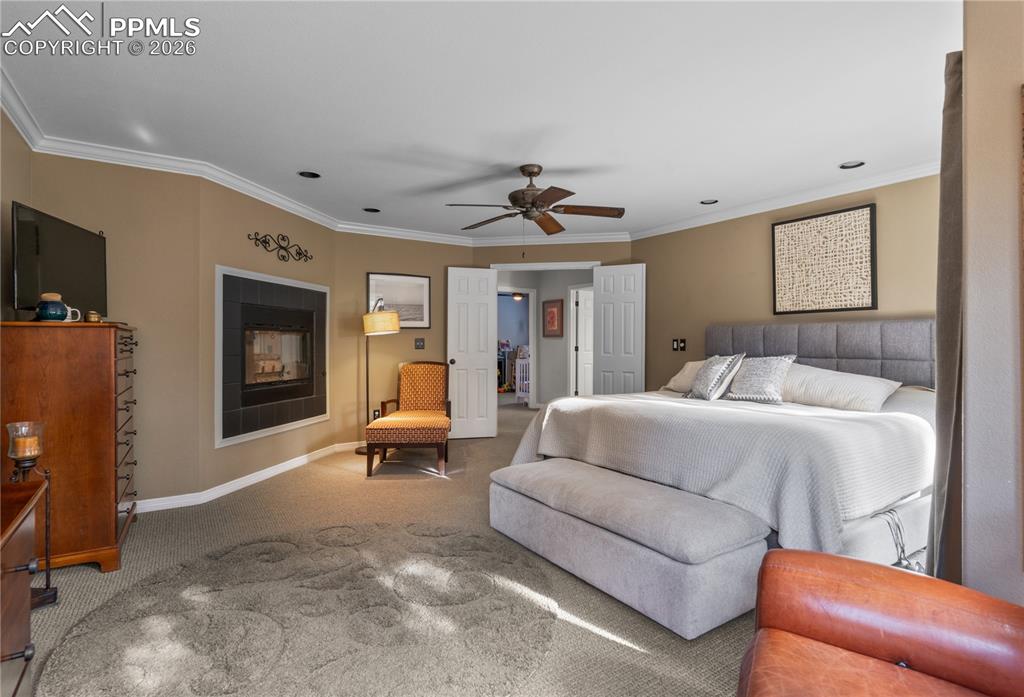 Image 24 of 38: This bedroom is spacious and has a spa like adjoining bath.
