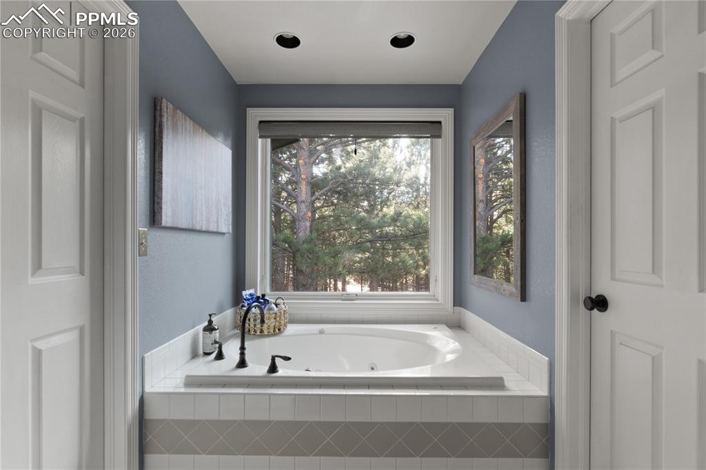 Image 25 of 38: Oversized Jetted Tub feels like a day at the spa.