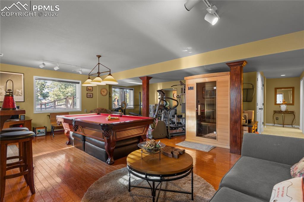 Image 32 of 38: This space walks out to your private backyard and hot tub.