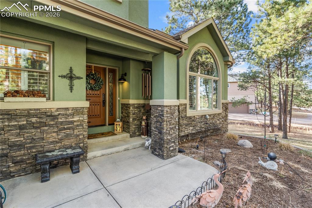 Image 6 of 38: The exterior is flawless and perched in the pines for privacy and serenity.