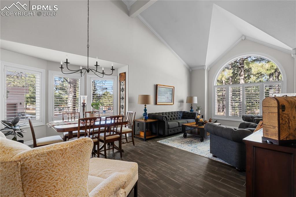Image 7 of 38: The living room with cathedral ceilings is a show stopper!