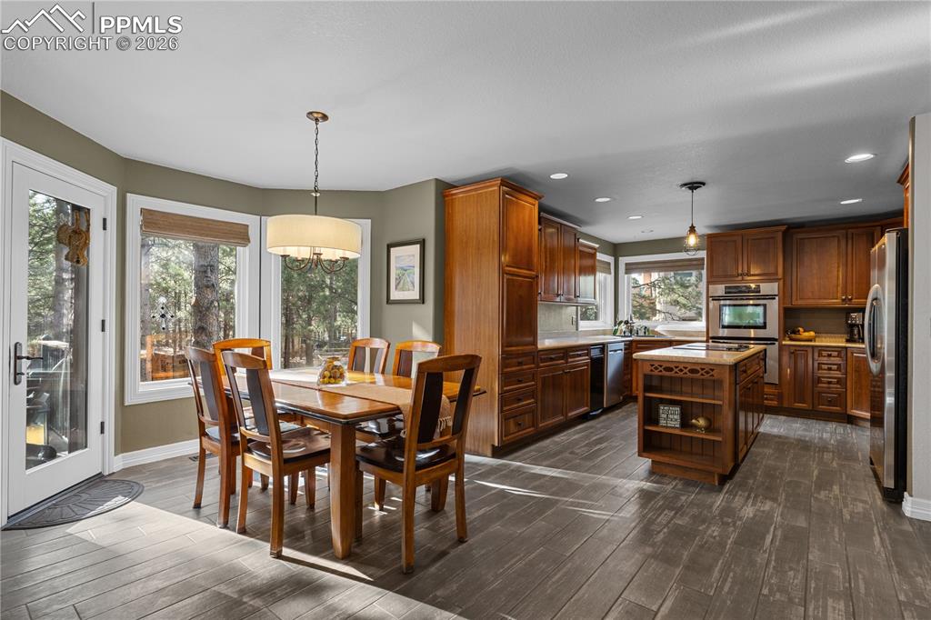 Image 8 of 38: This open floor plan flows from all of the major rooms of the house.  The k