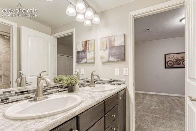 Image 31 of 50: Lower level-full bath
