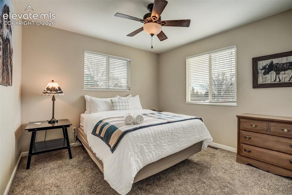 Image 30 of 50: Wall-to-wall carpeting and neutral wall tones