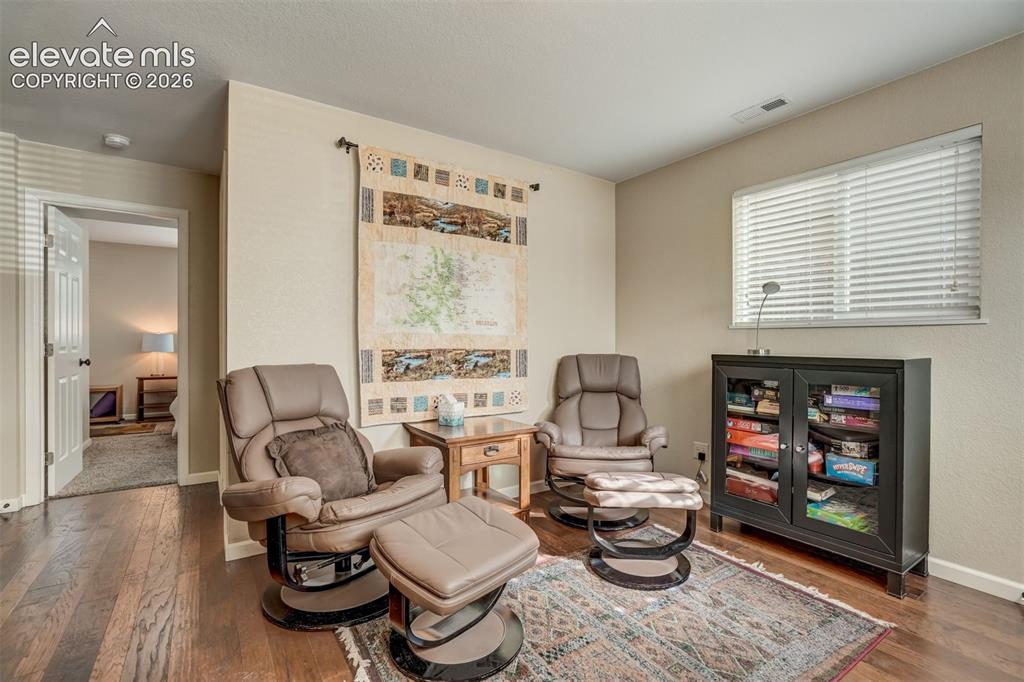 Image 8 of 50: Wood-finish flooring with a neutral wall color