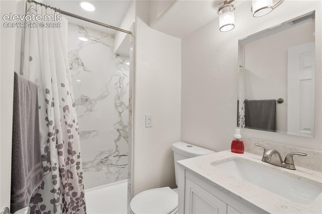 Image 22 of 34: Bathroom in basement