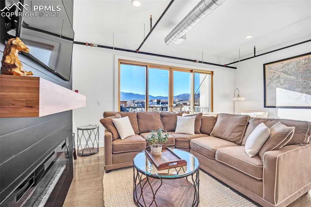 Image 18 of 48: Living room featuring recessed lighting, light wood-style flooring, a mount