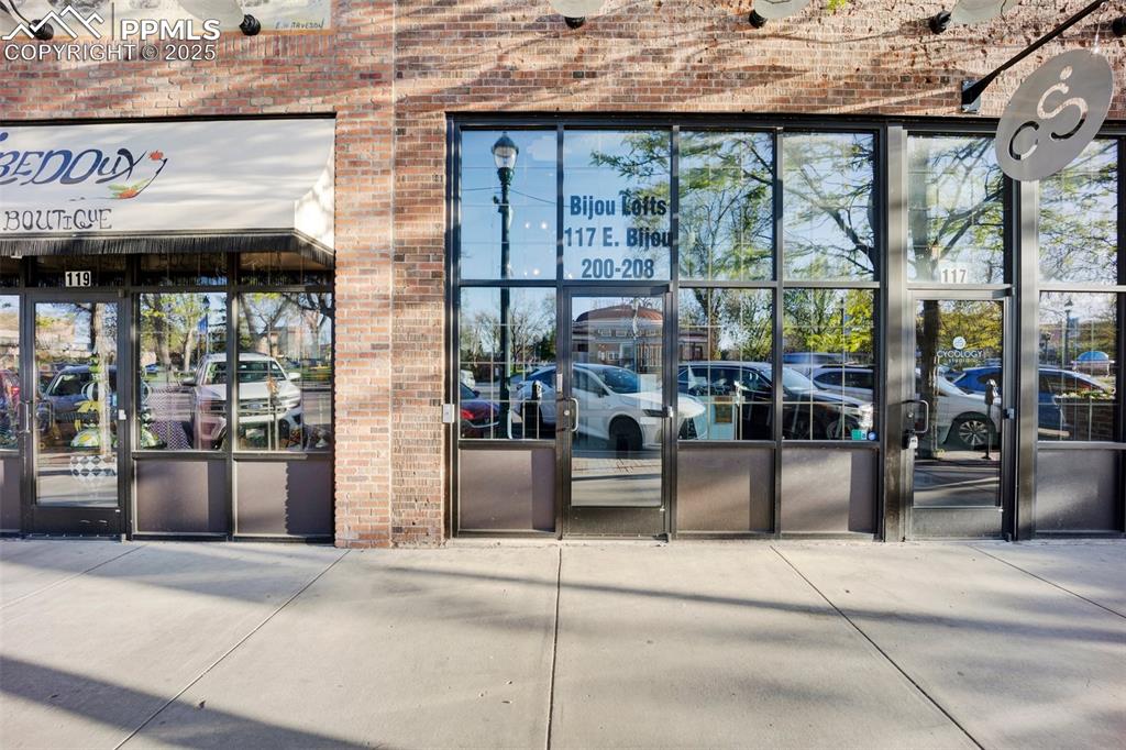 Image 2 of 48: Property entrance featuring brick siding