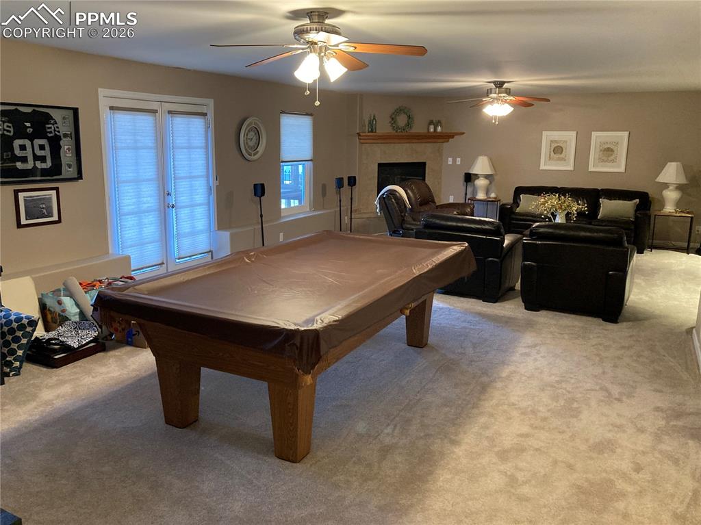 Image 11 of 12: The large family room in the basement has lots of space for that pool table