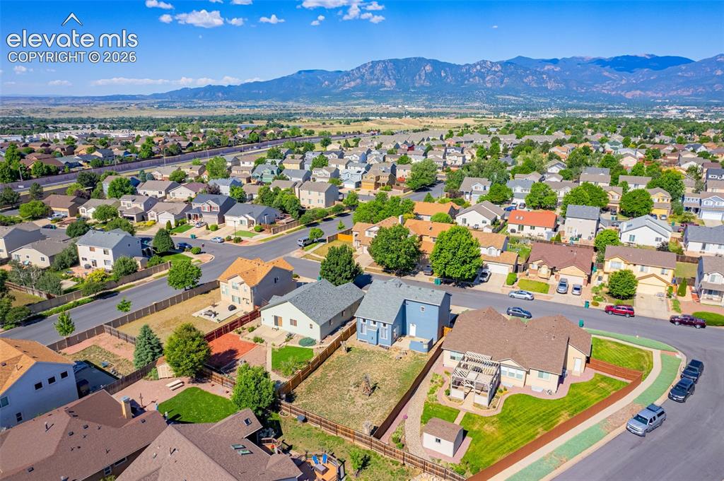Image 35 of 42: Expansive residential neighborhood featuring numerous single-family homes w