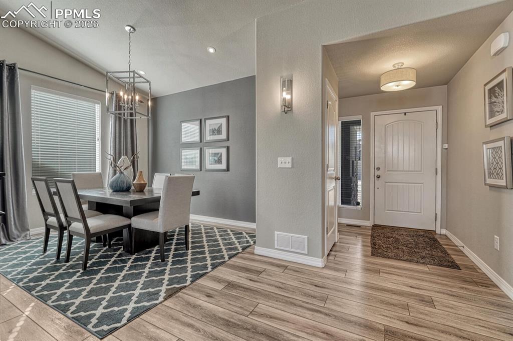 Image 11 of 50: The Front Entry leads into the Formal Dining Room and has a coat closet and