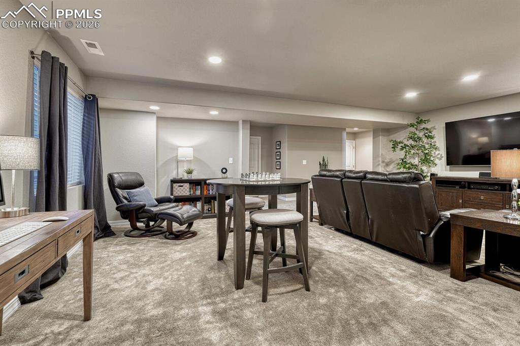 Image 36 of 50: Game and Sitting Area off the Basement Family Rec Room.  