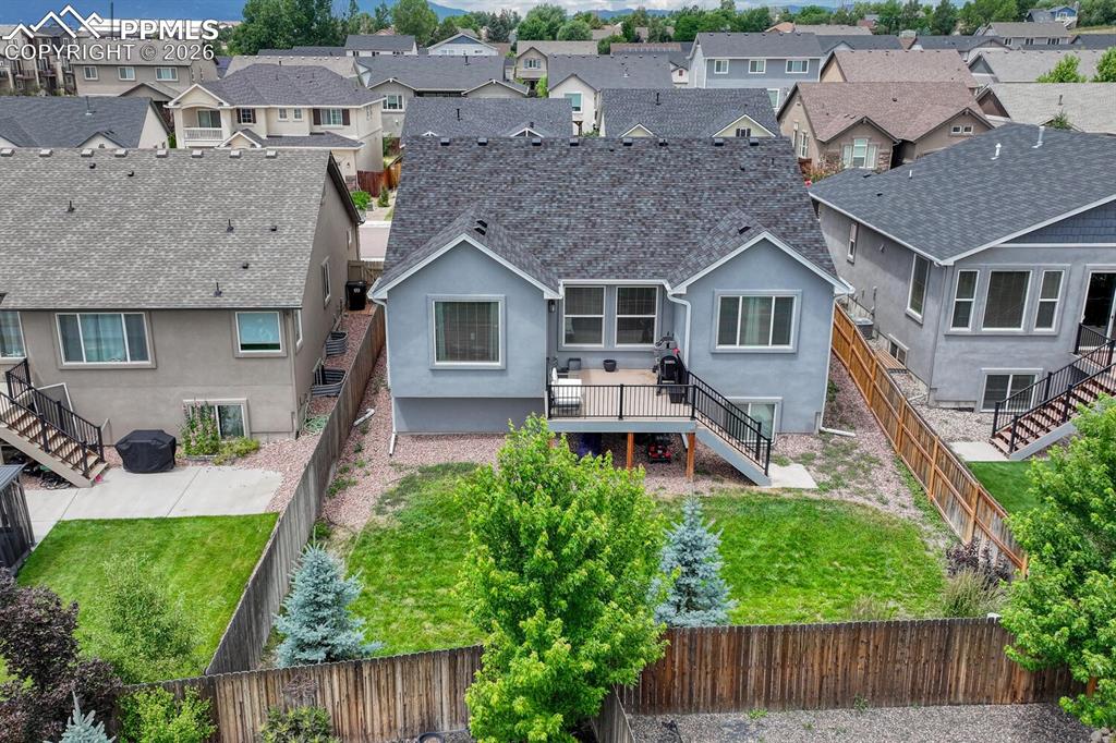 Image 47 of 50: Aerial rear view of home and backyard.