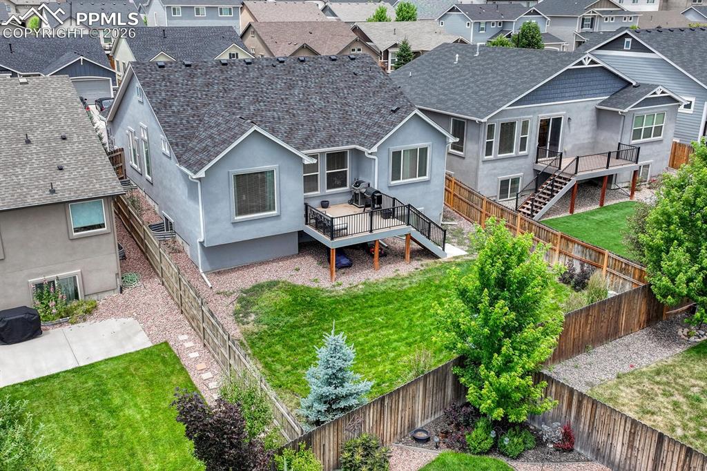 Image 48 of 50: Aerial rear view of home and backyard.