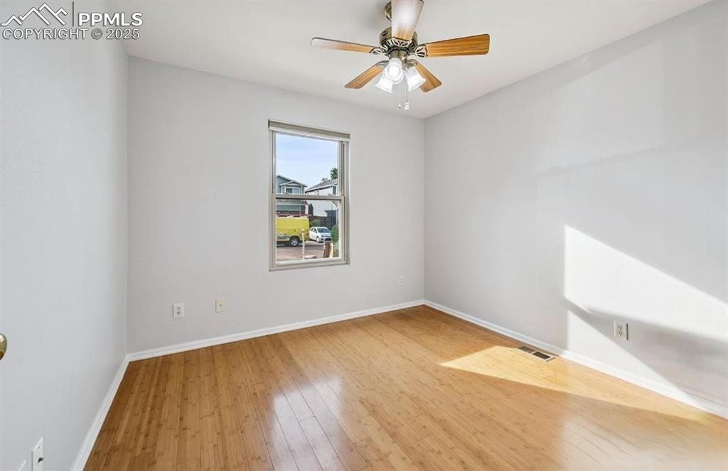 Image 8 of 18: Spare room with light wood-style flooring and ceiling fan