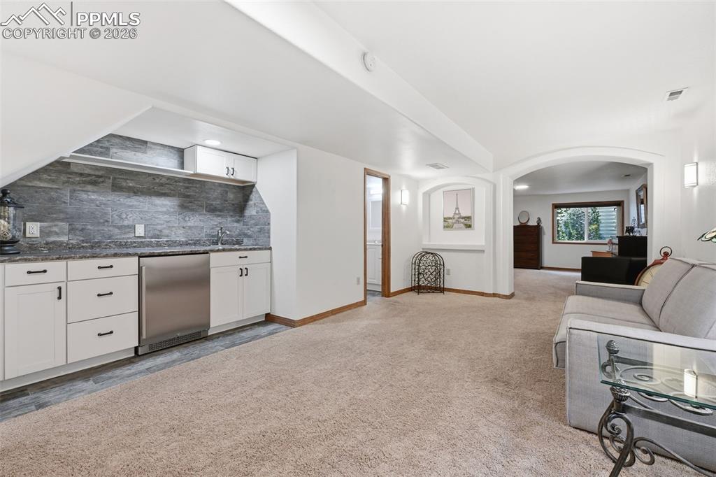 Image 28 of 50: Secondary suite in basement with mini bar