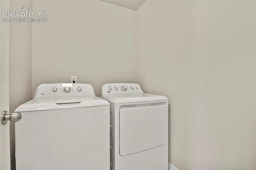 Image 20 of 29: Upstairs laundry where all the clothes are