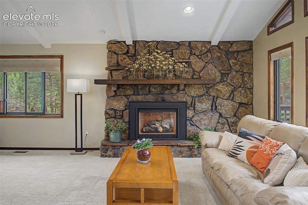 Image 11 of 49: Lichen Rock with Mantle Gas Fireplace