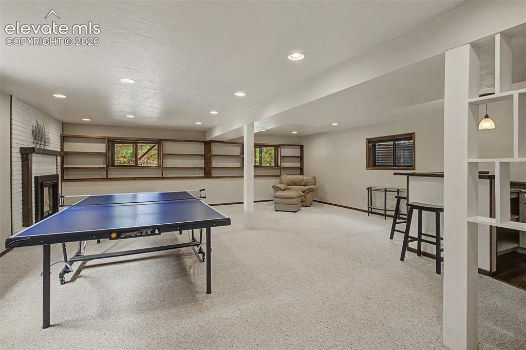 Image 31 of 49: Large Family room offers different living areas