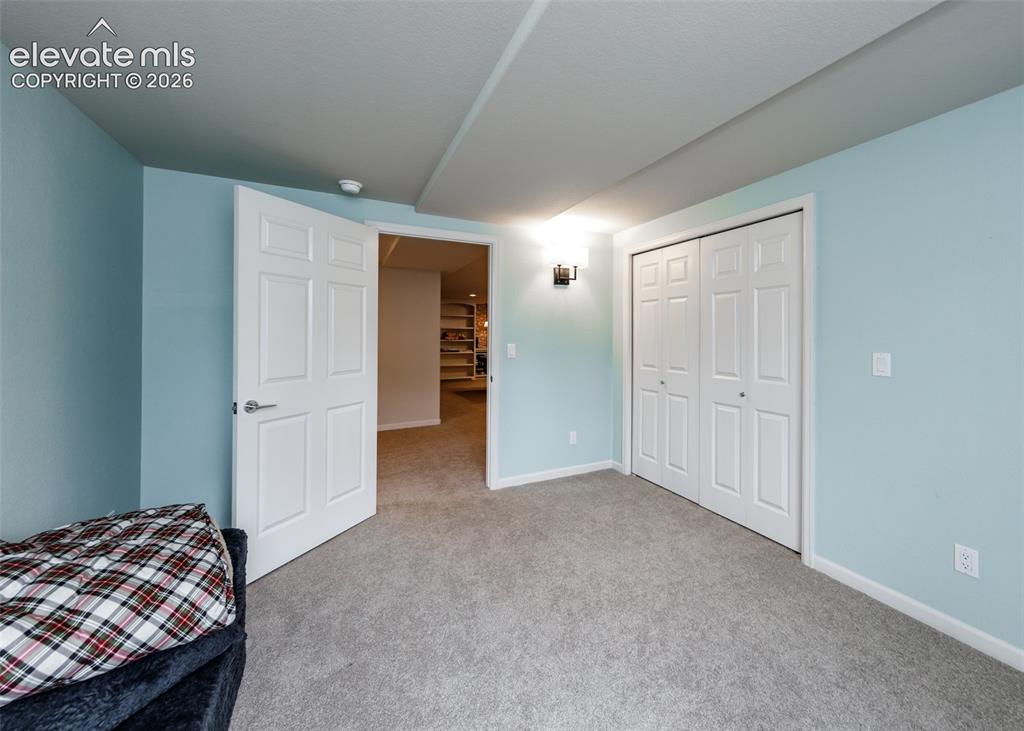 Image 36 of 50: Bedroom in basement.