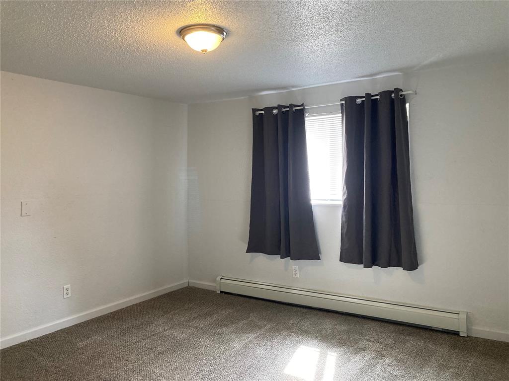 Image 7 of 10: Front bedroom