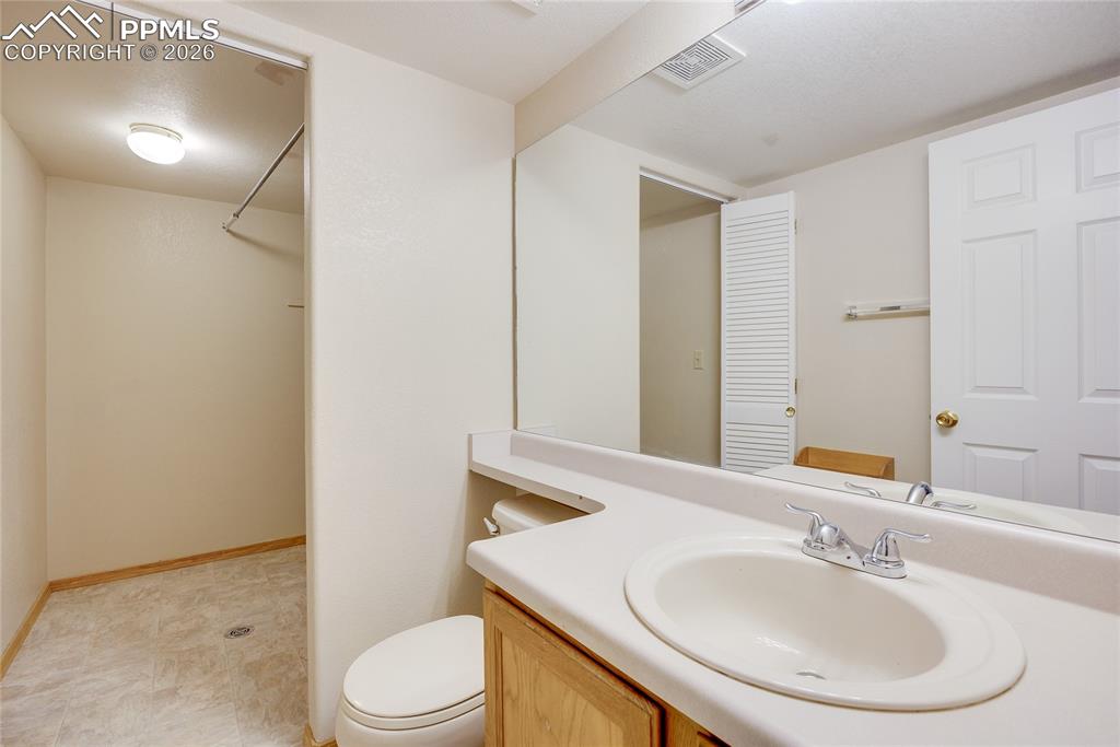 Image 11 of 32: Bathroom with vanity and toilet