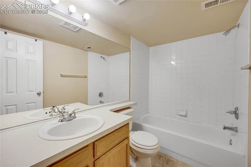 Image 25 of 32: Bathroom featuring vanity and shower / bathtub combination