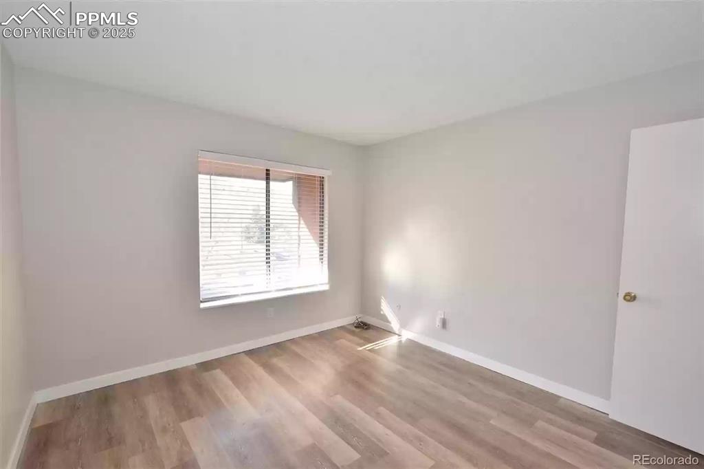 Image 17 of 28: Spare room featuring light wood-style flooring and baseboards