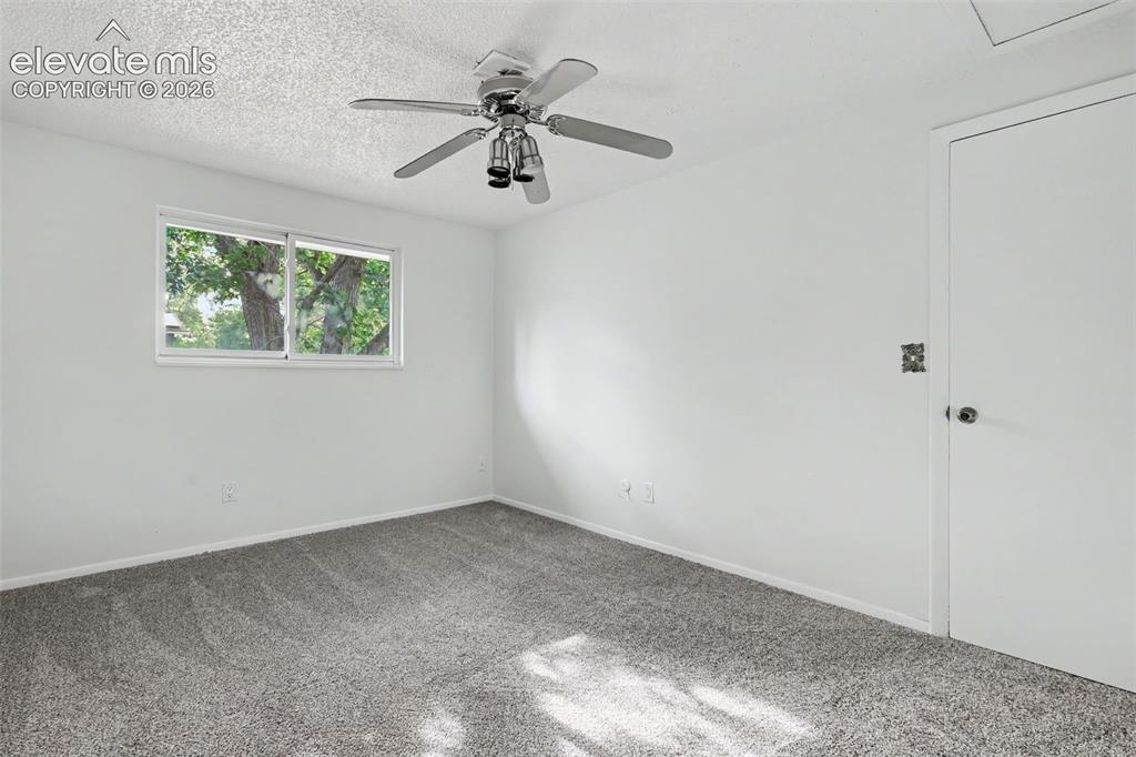 Image 18 of 32: Secondary bedroom with natural light and closet storage.