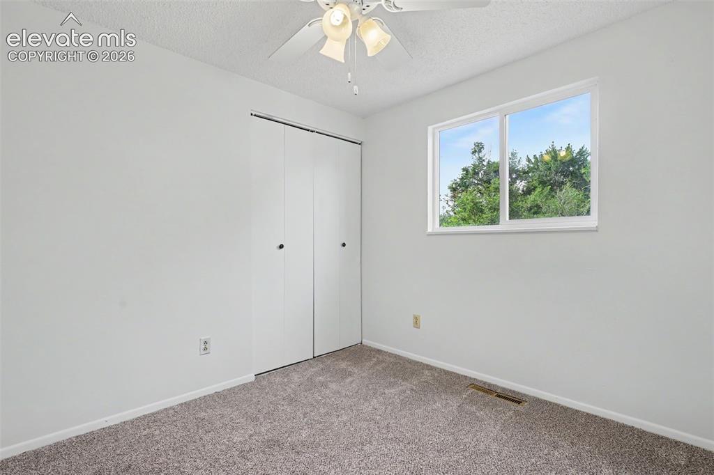 Image 22 of 32: Additional bedroom ideal for guests, office space, or hobbies.