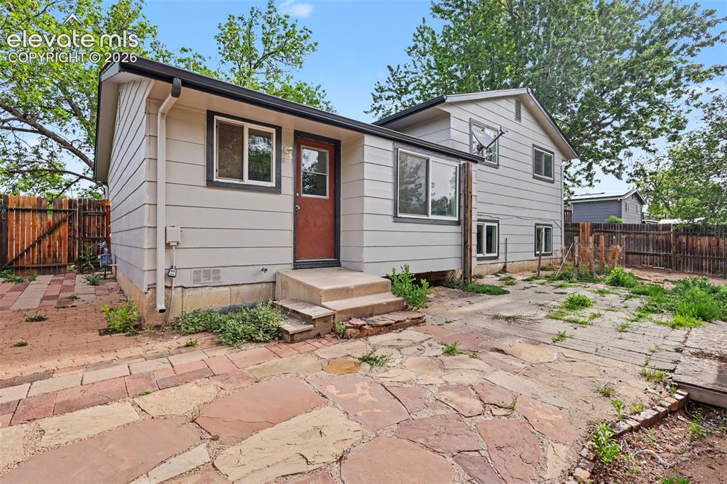 Image 26 of 32: Fenced backyard with patio space and room to personalize over time.