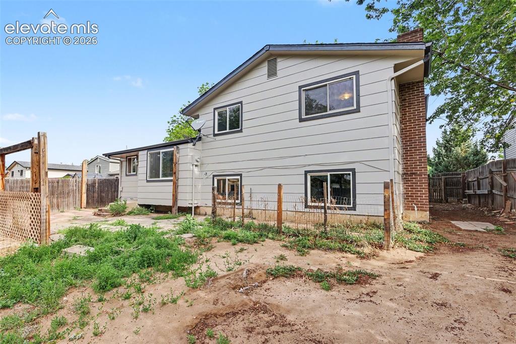 Image 28 of 32: Rear exterior showcasing the home