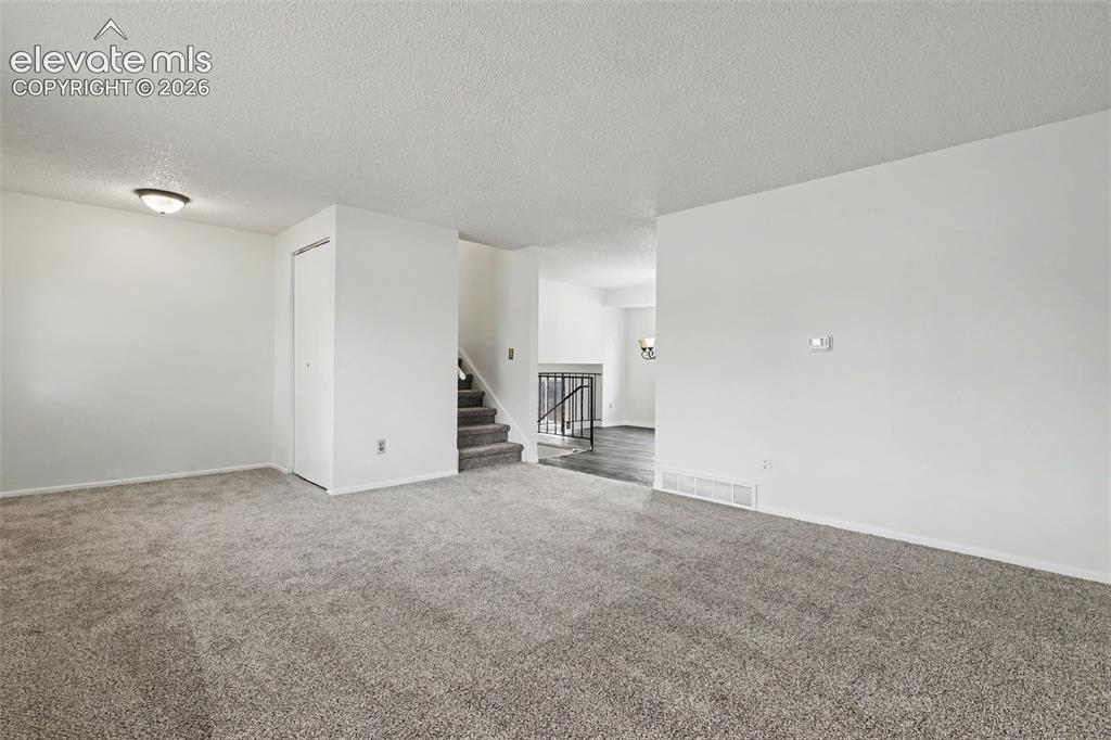 Image 4 of 32: Main living area with easy flow into the rest of the home.