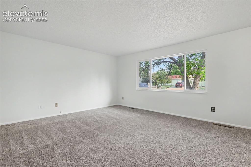 Image 5 of 32: Second view of the bright and open living room.