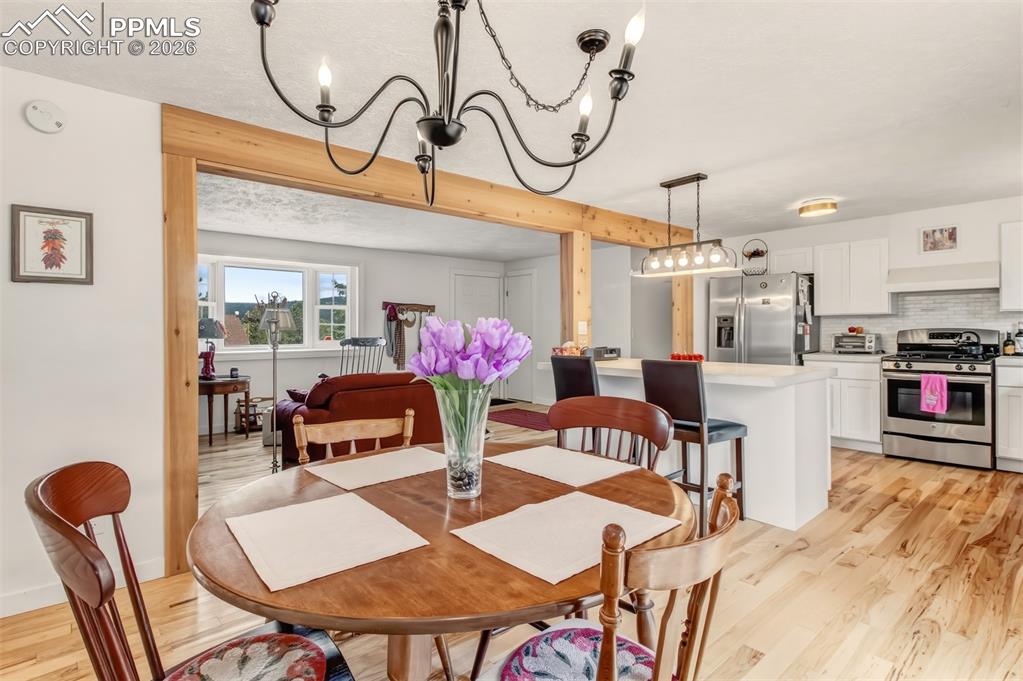 Image 11 of 31: Dining area with walk out to back deck