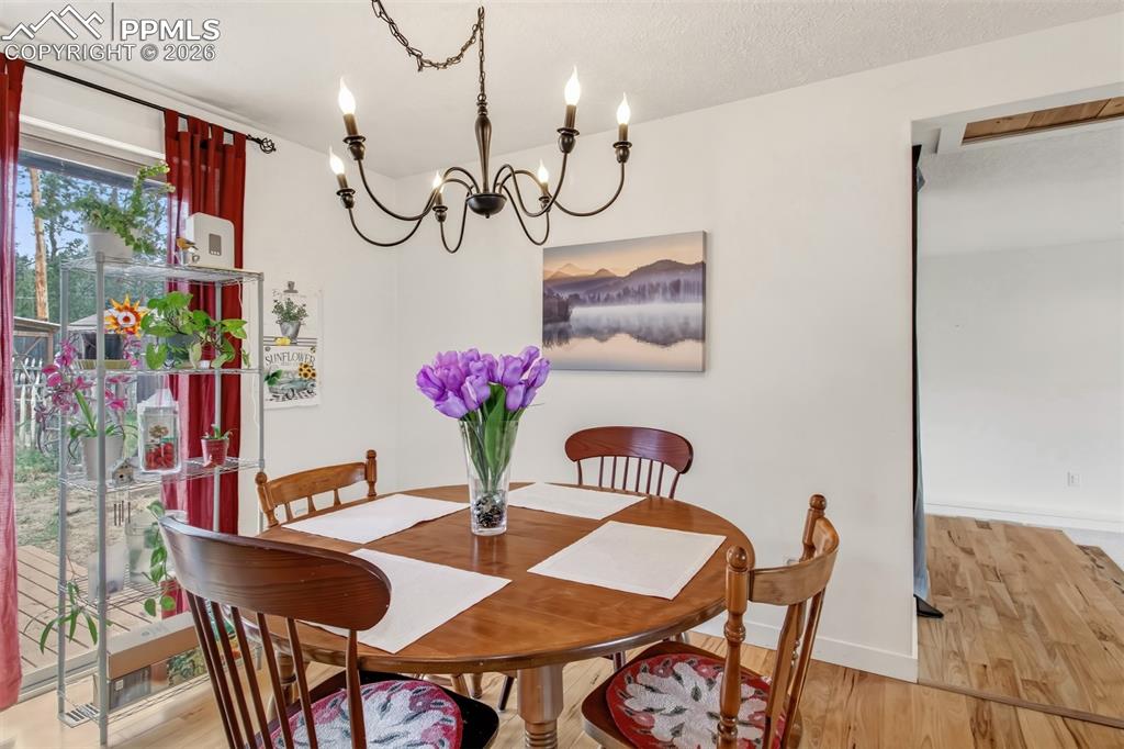 Image 12 of 31: Dining area with walk out to back deck