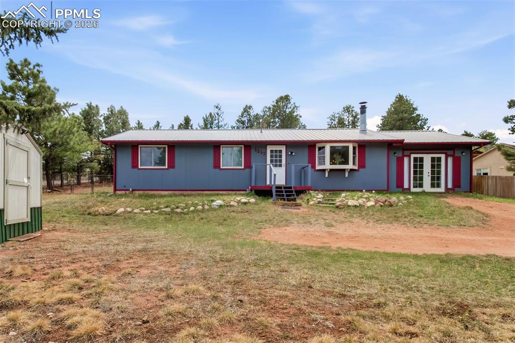 Image 2 of 31: Front of this lovely mountain ranch-style home
