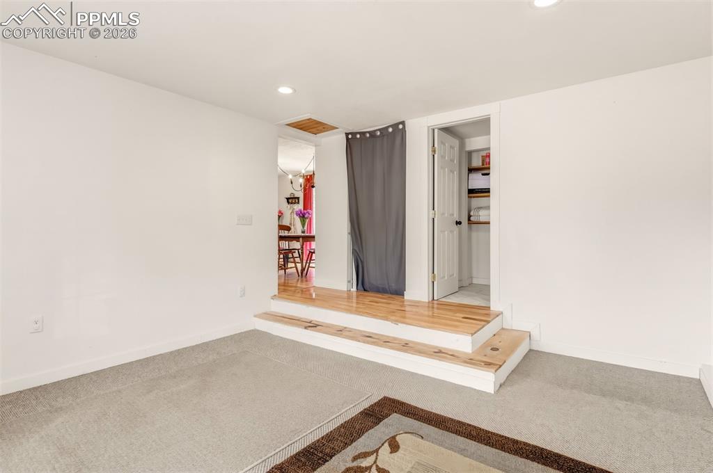 Image 20 of 31: Bonus room with French doors an attached 3/4 bathroom and laundry room