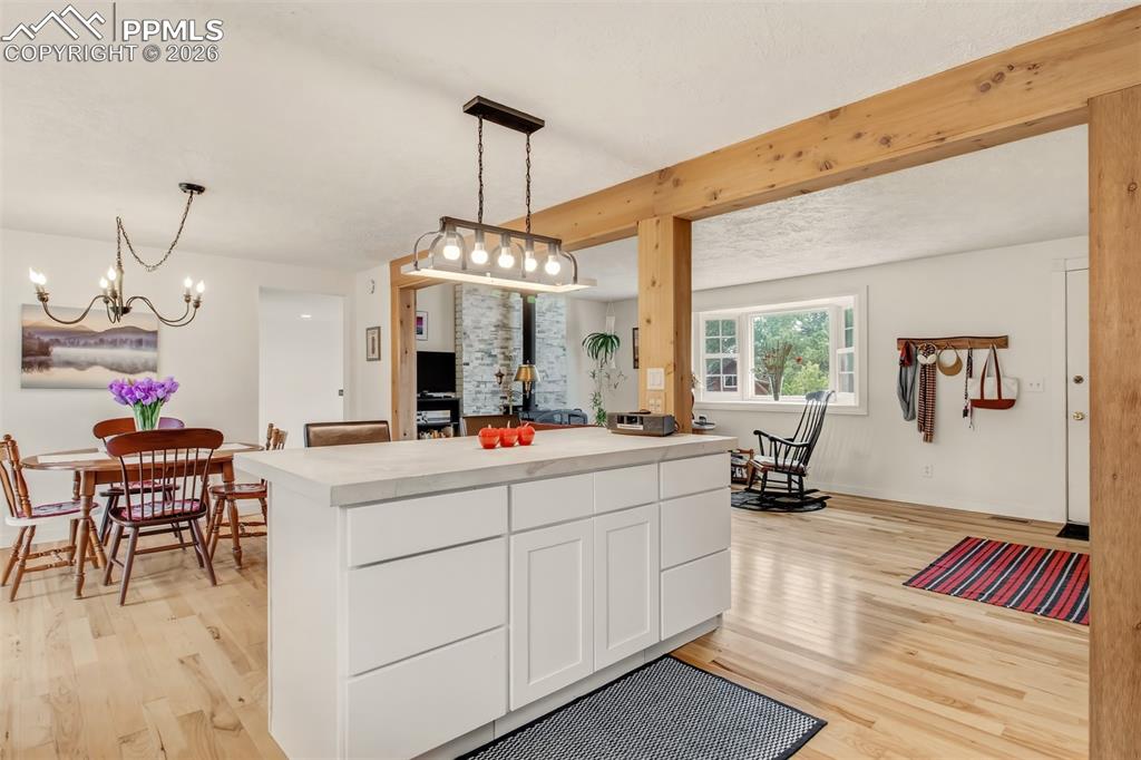 Image 9 of 31: Open concept farmhouse kitchen, with concrete countertops, matching applian